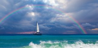 Stormy Seas with full Arch Rainbow